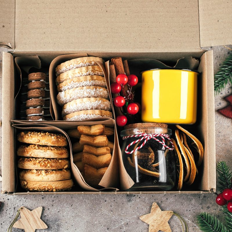 Christmas cookie gift box. Assorted shortbread cookies with holiday decoration.
